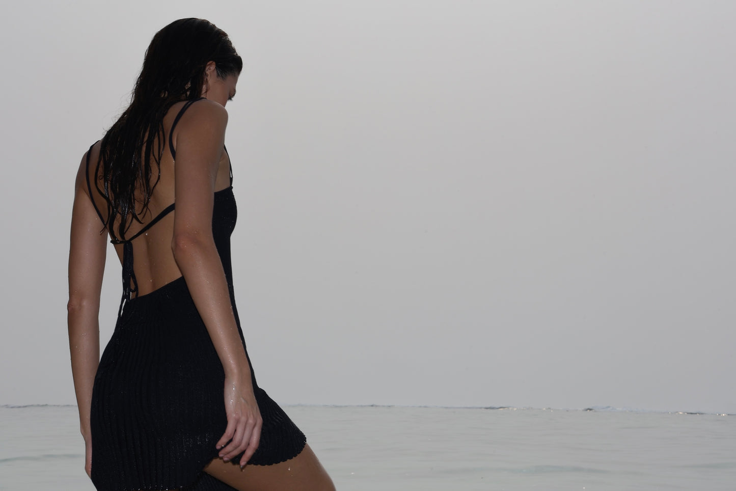 KNITTED STRAPPY MINI DRESS WITH PLEATS AT THE BOTTOM BLACK