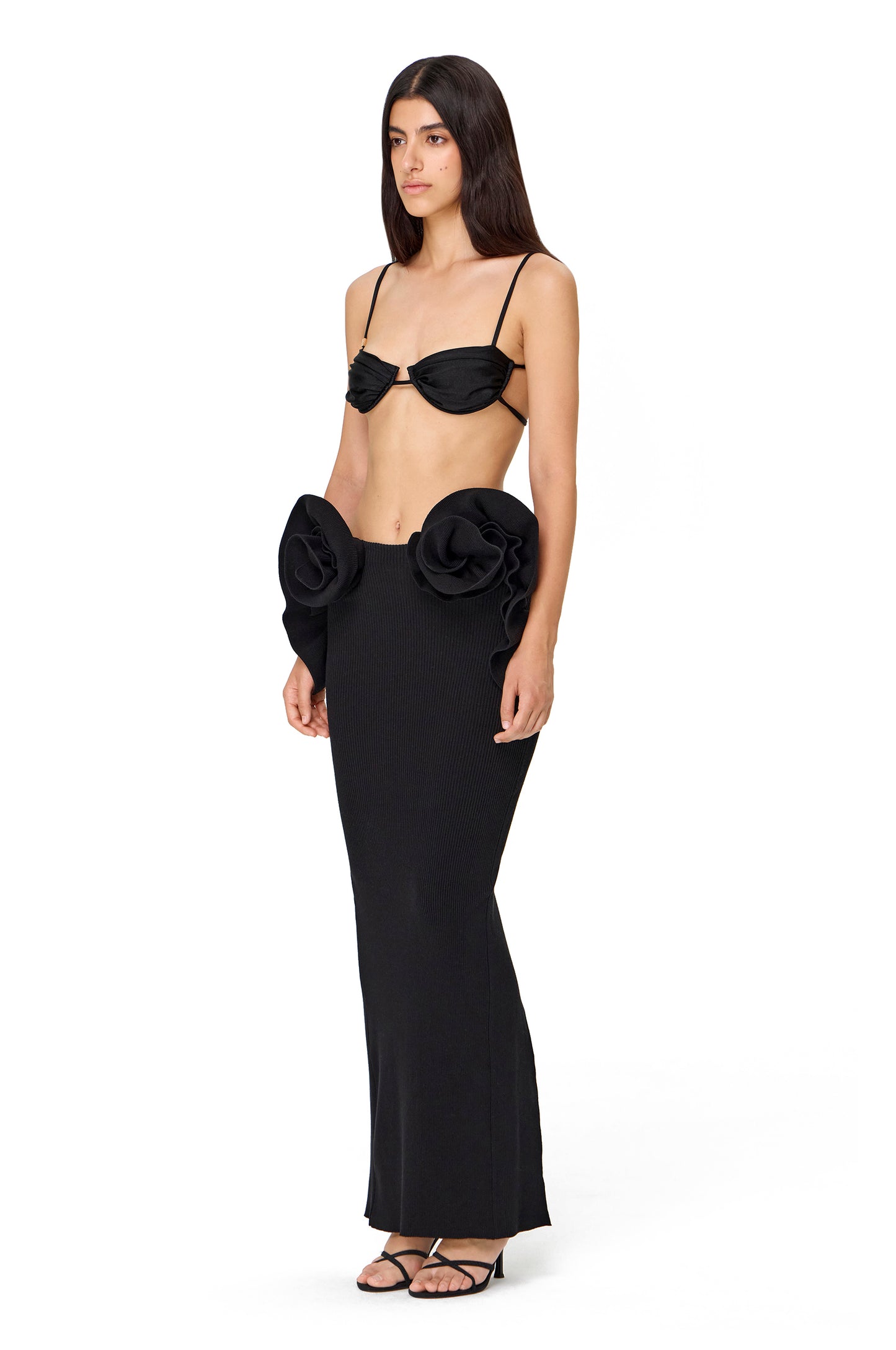 KNITTED MAXI SKIRT BACK SLIT AND FLOWER DECOR ON THE HIPS BLACK